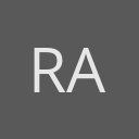 Ratna Amin avatar consisting of their initials in a circle with a dark grey background and light grey text.