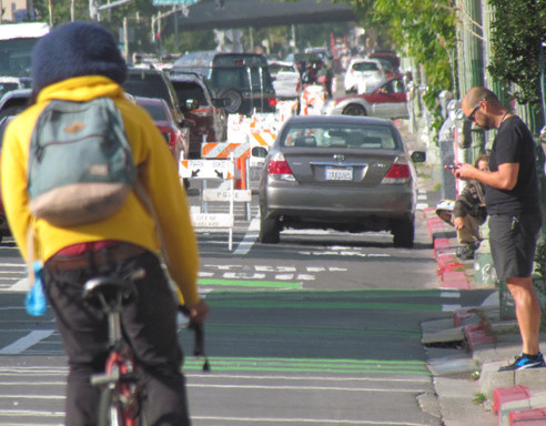 Unfortunately it is very easy to get pictures of cars parked in the new bike lanes. Photo: Melanie Curry/Streetsblog 