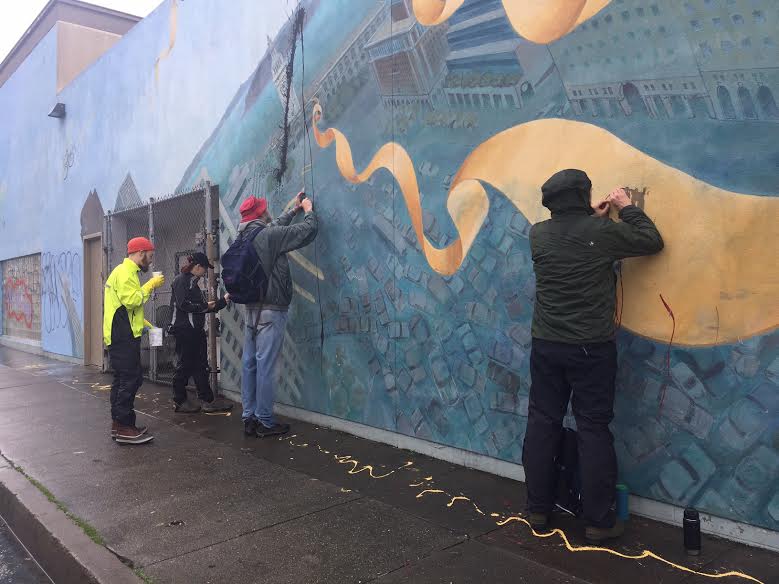 Volunteers scraped and scrubbed in the rain Saturday morning and early afternoon. Photo: SFBC/Melyssa Mendoza