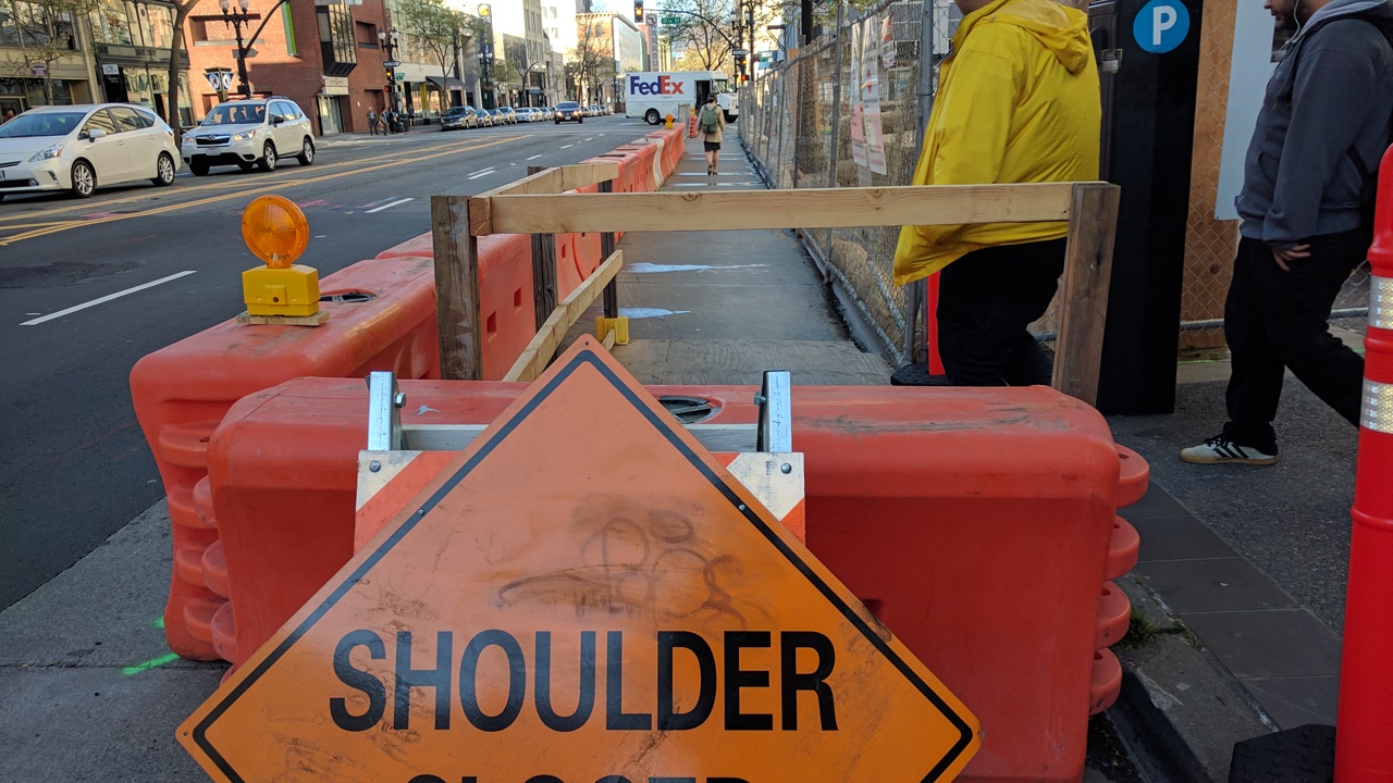 Construction barriers can keep cyclists safer than paint, and take less time to put in. Photo: Streetsblog