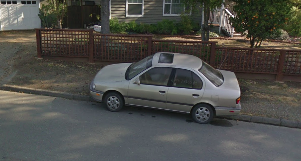 A very typical scene on Proctor road. Local law enforcement refuses to issue tickets to people who park on the sidewalk, ostensibly because the curb height isn't regulation. Image: Google Maps