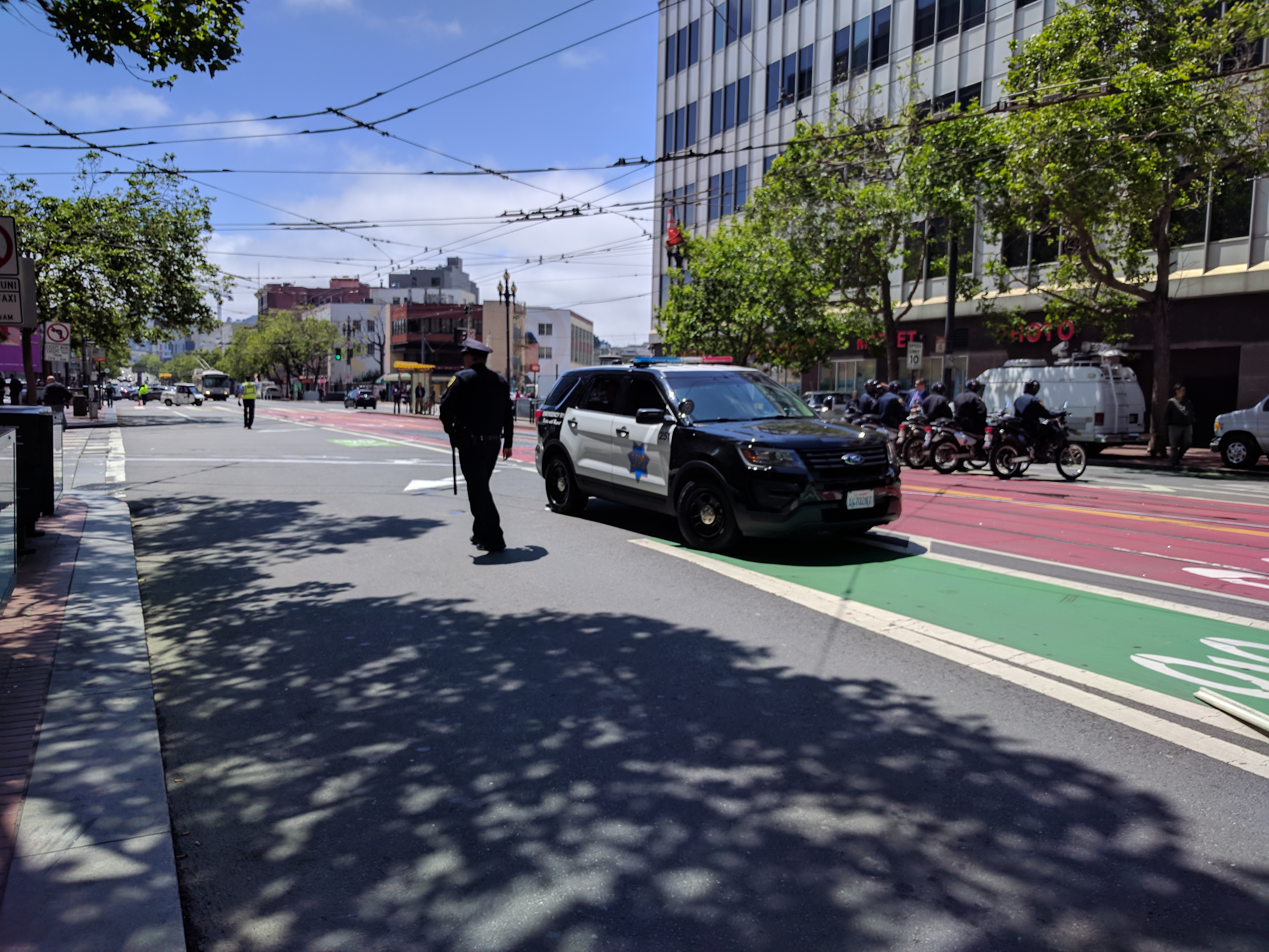 And this is how SFPD clears Market Street of protesters. Sigh. In fairness, the SFPD cruiser was moved shortly after this photo was taken