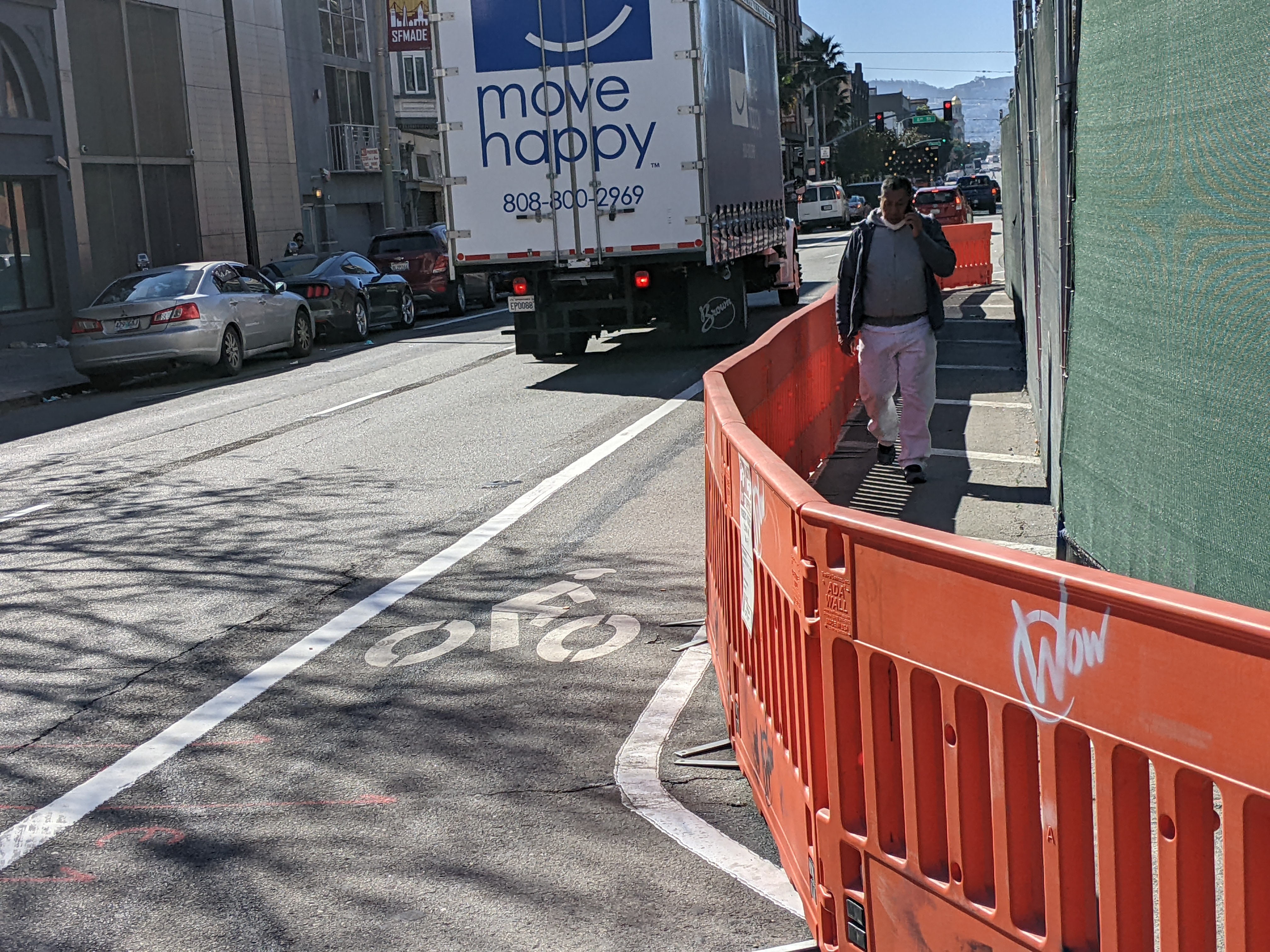 Where the bike lane bends around the construction site. The passing box truck is same type of vehicle that took Rothstein's life.