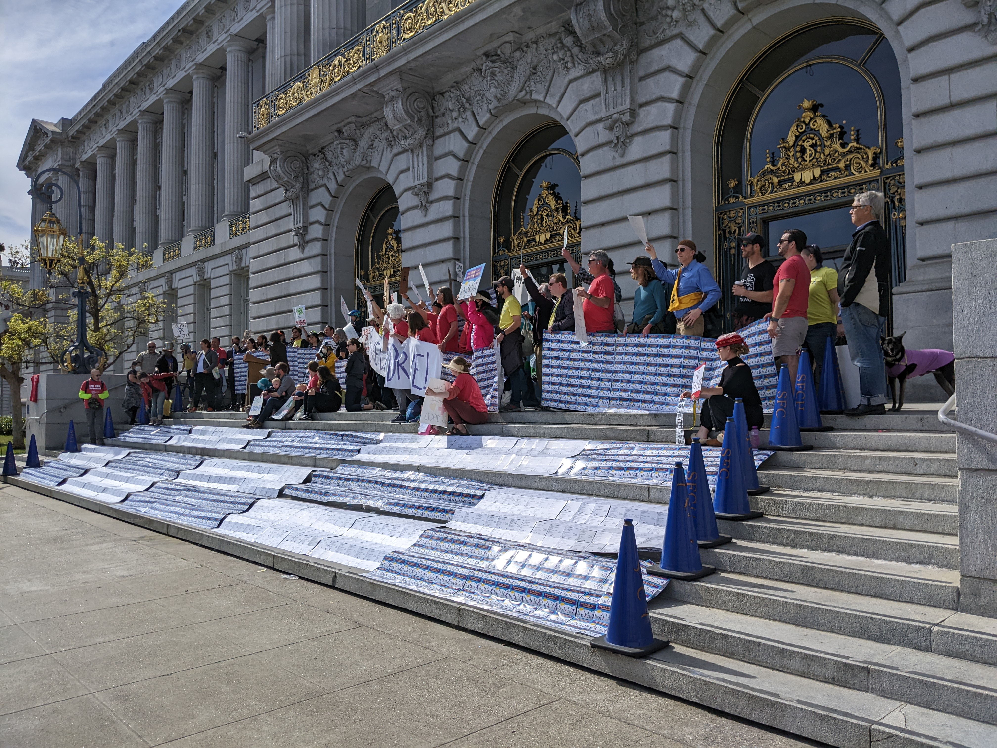 Reams of post cards, supporting the J.F.K promenade, covered the stairs of city hall