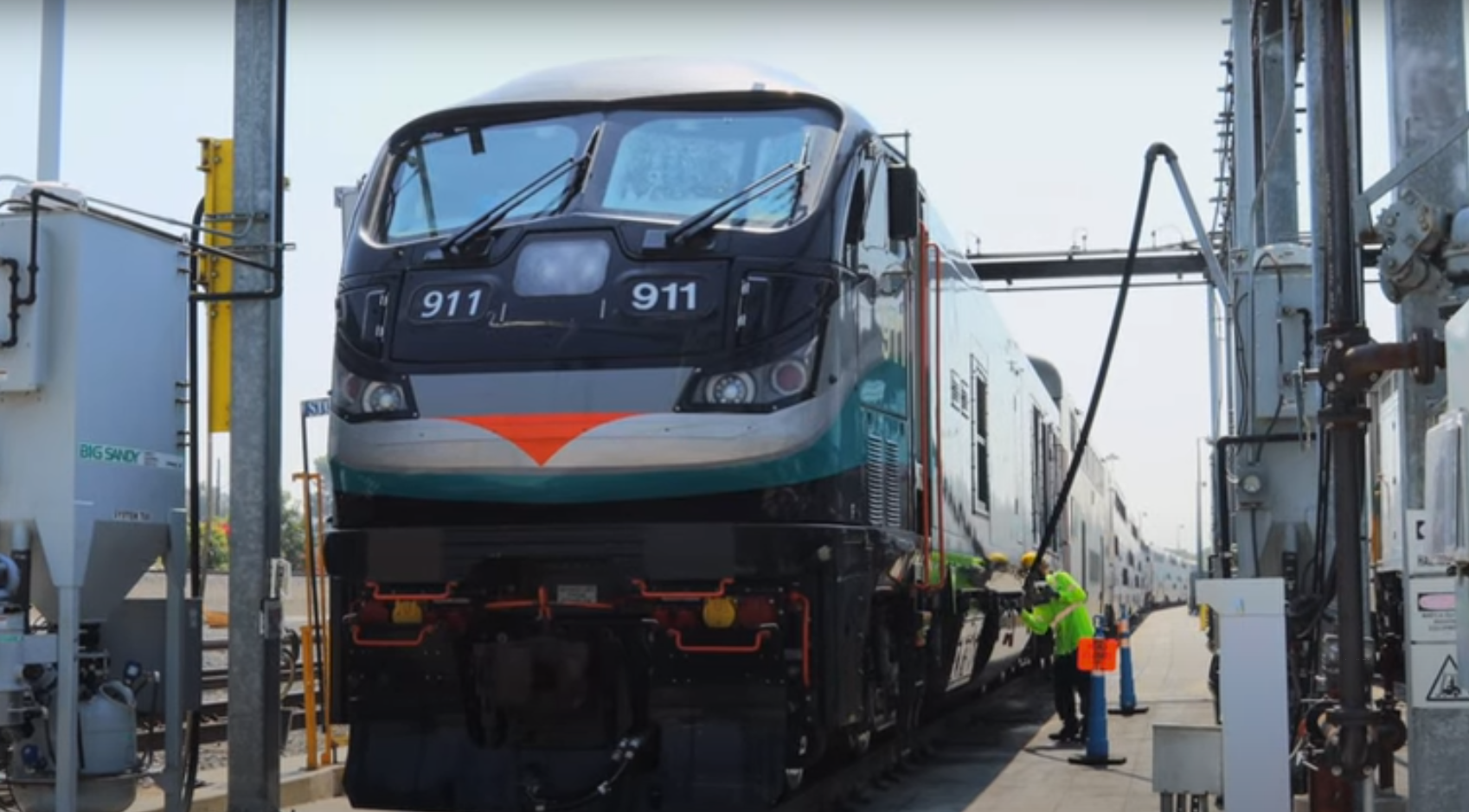 Metrolink putting diesel fuel into one of its newest locomotives. In two years, Caltrain will no longer use fuel--period. Image from a Caltrain promotional film