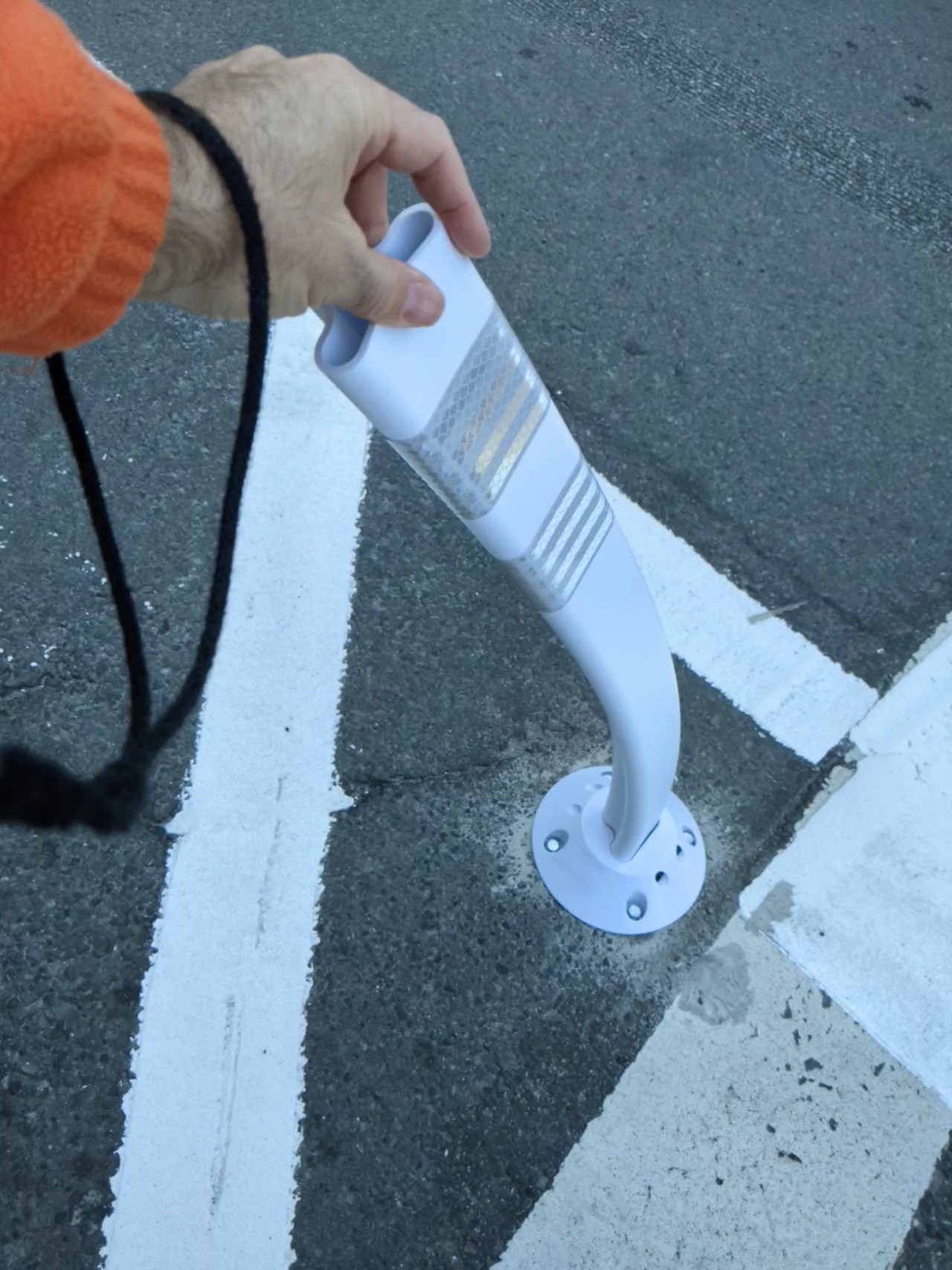 A look at what SFMTA now calls a "protected" bike lane--infrastructure that is best suited to preventing damage to cars, not saving lives. Photo: Streetsblog/Rudick