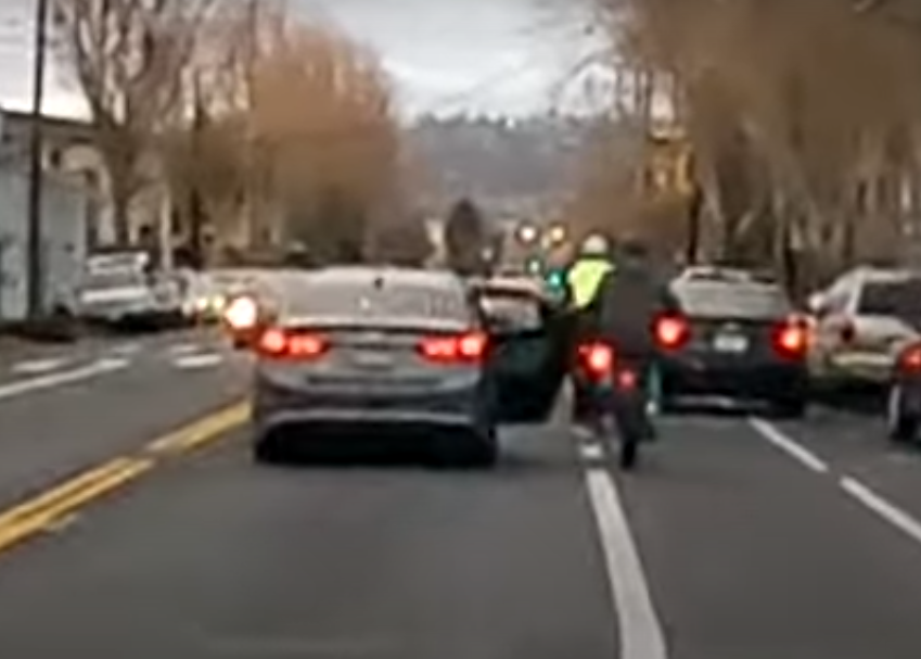 A screen shot from bike-camera video of motorists intentionally dooring cyclists on Adeline. Photo: East Bay Bike Party